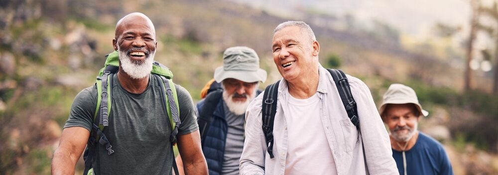 A group of men hiking together.