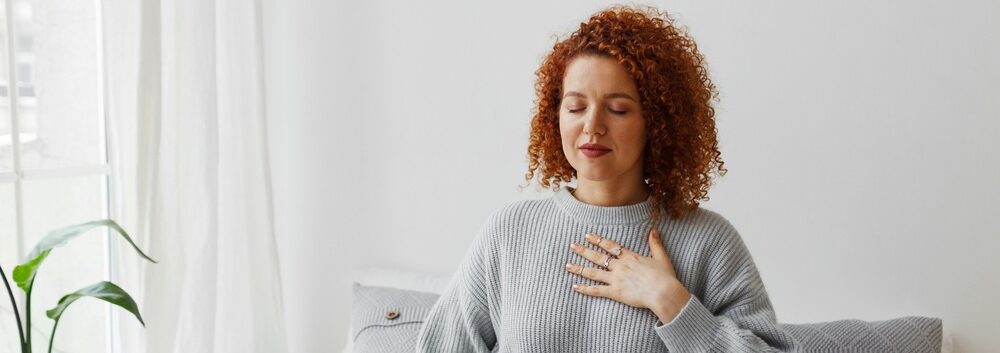 A lady focusing on her breathing.